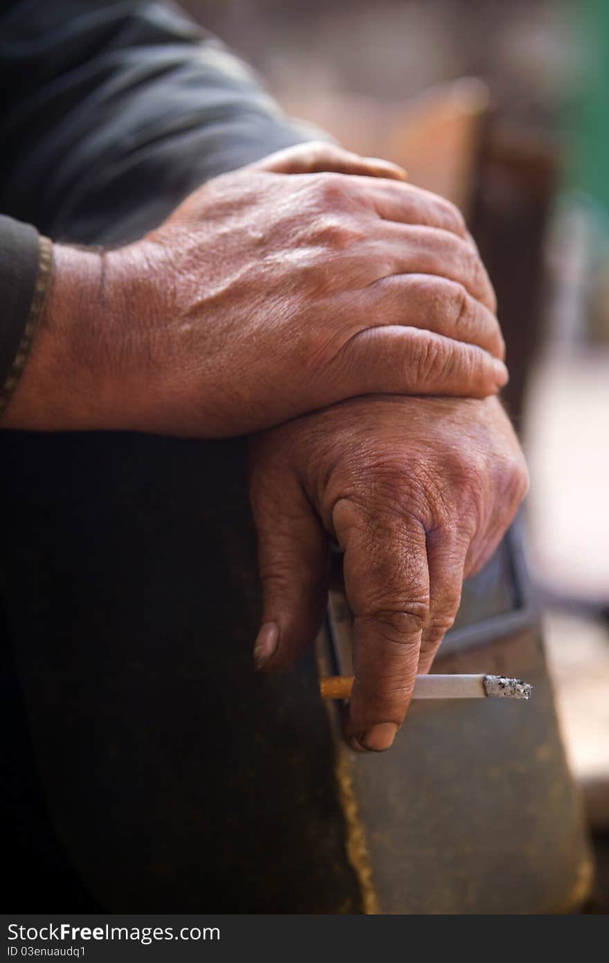 Hand working with a cigarette