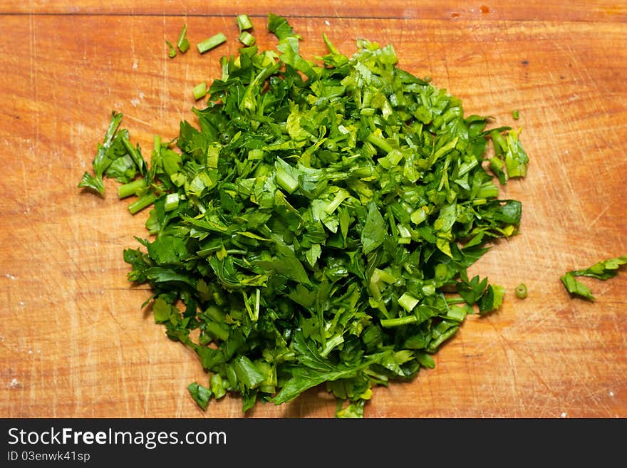 Green parsley on a wood board