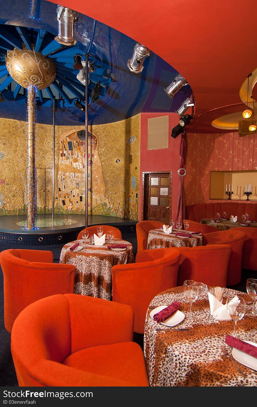 Interior of the cafe with tables and lamps