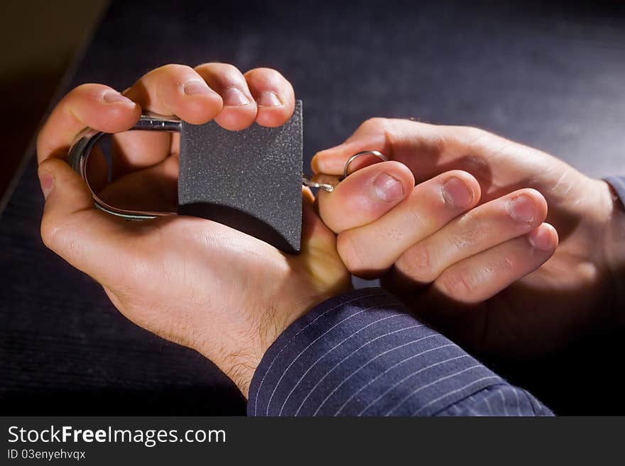 Man opens the padlock