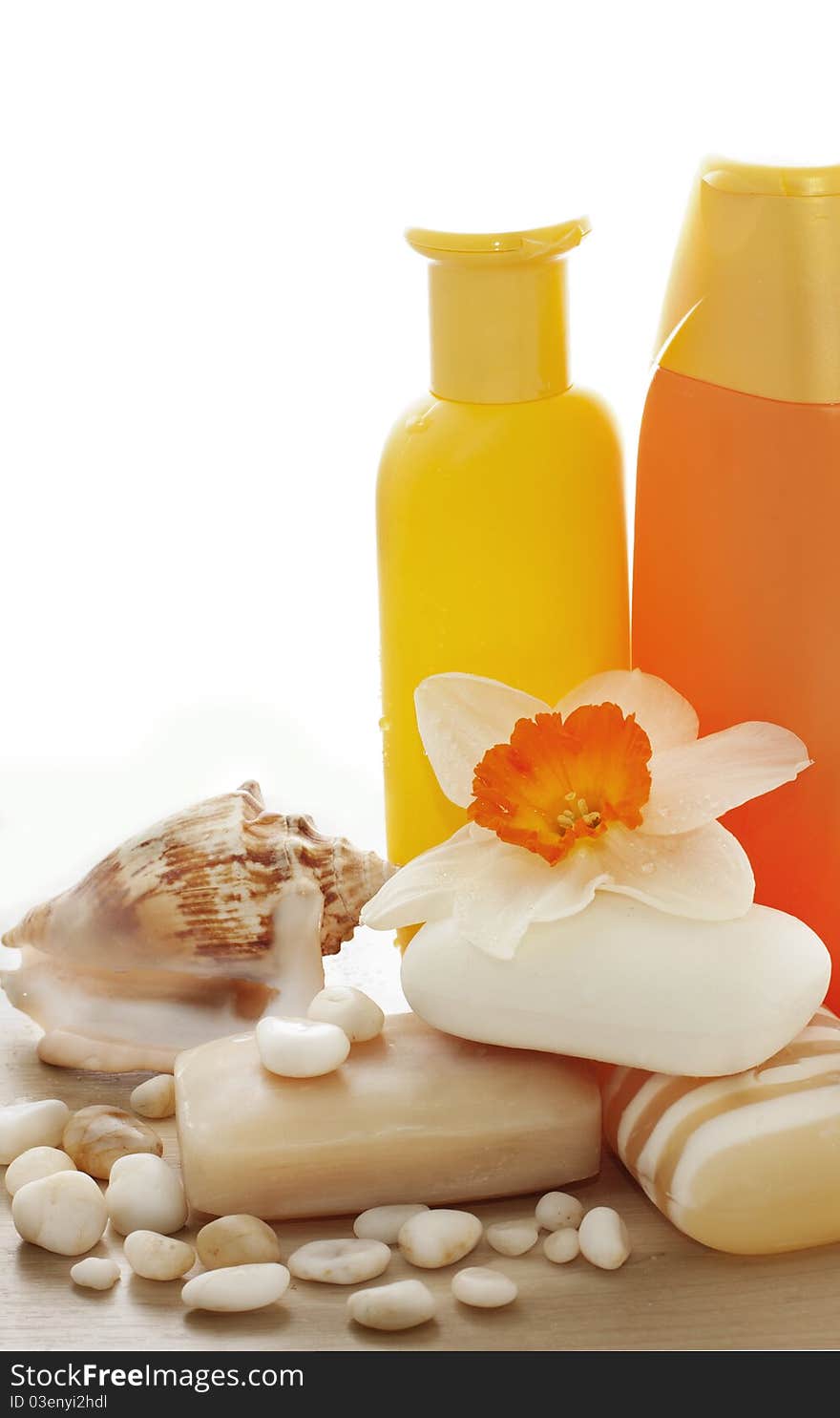 Soap, shampoo, flowers and sea stones