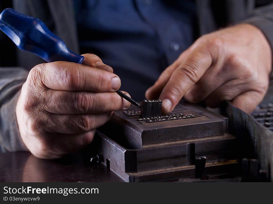 Men Creates A Metallic Plate