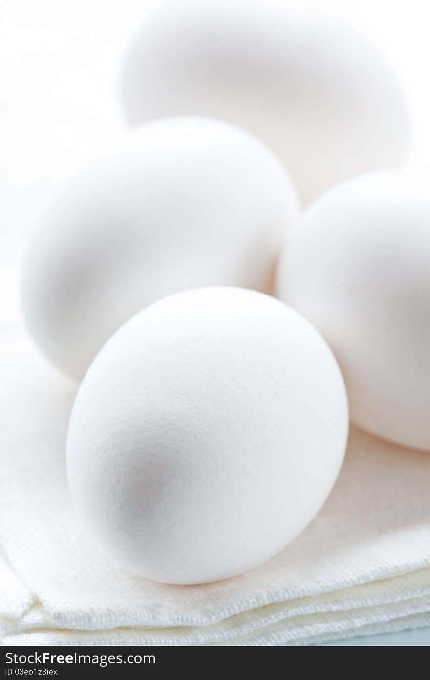 Eggs on a white background, shallow dof.