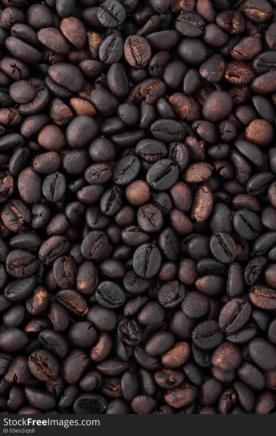 Many black coffee beans as background