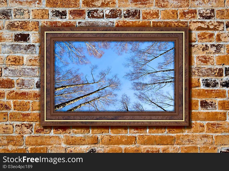 Photo in modern frame on the old brick wall. Photo in modern frame on the old brick wall