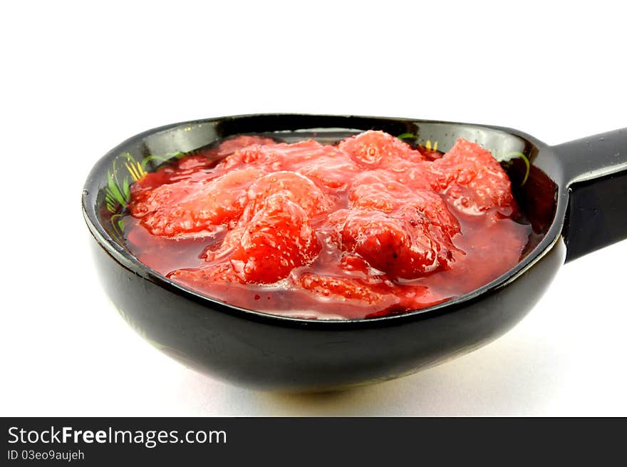 Strawberry jam in a spoon