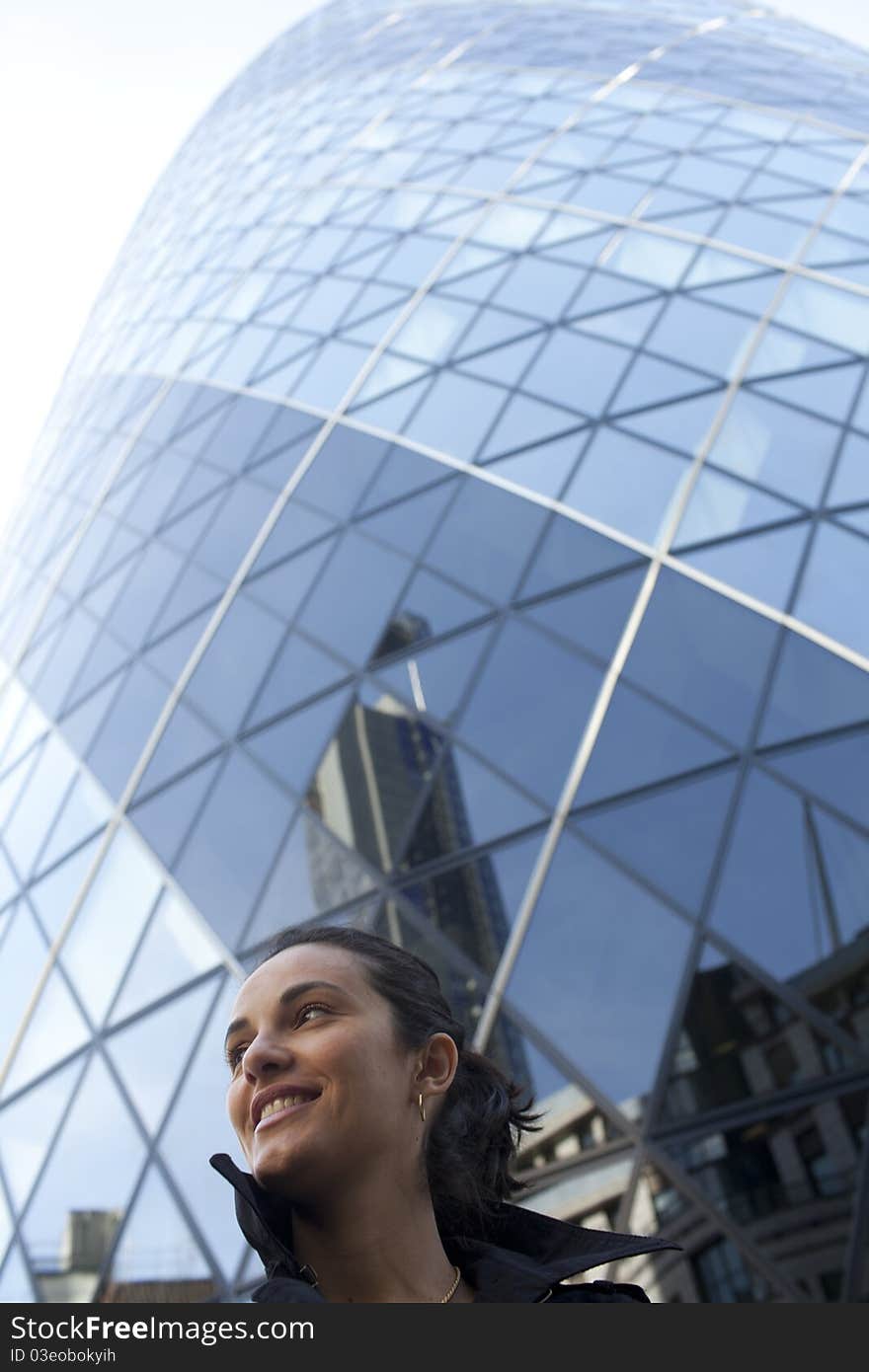 Woman in front of 30 St Mary Axe in London