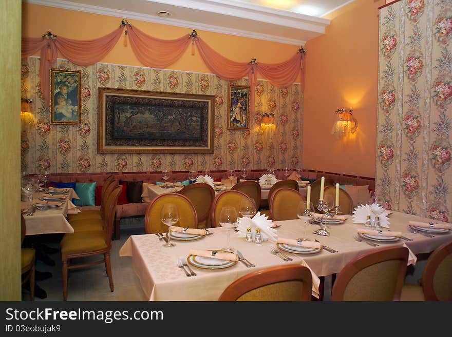 Interior of the cafe with tables and lamps