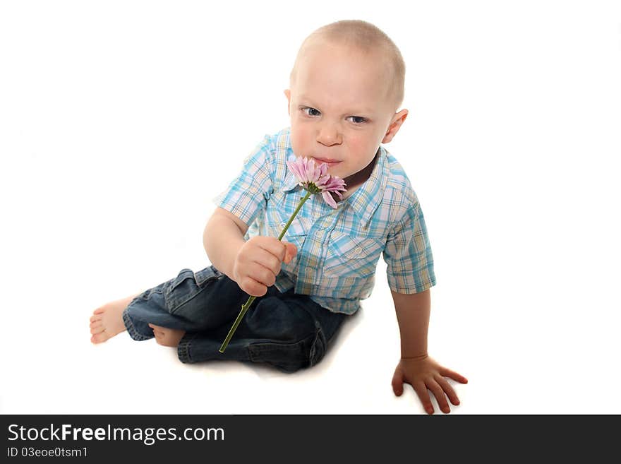 Boy Smelling Flower