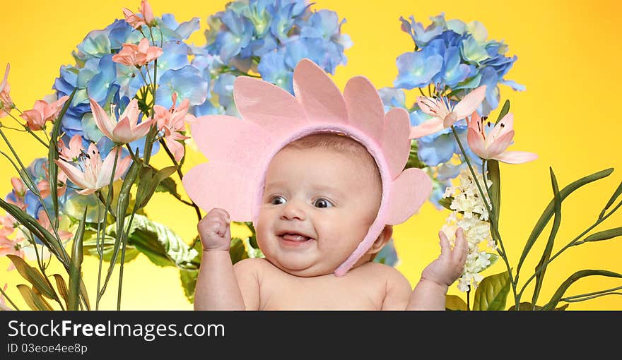 A little girl surrounded by flowers. A little girl surrounded by flowers