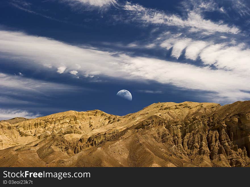 Moon rises over the desert mountains. Moon rises over the desert mountains