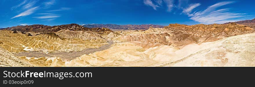 Beautiful desert scene with golden sand dunes in the distance at Death Valley National Park, California. Beautiful desert scene with golden sand dunes in the distance at Death Valley National Park, California