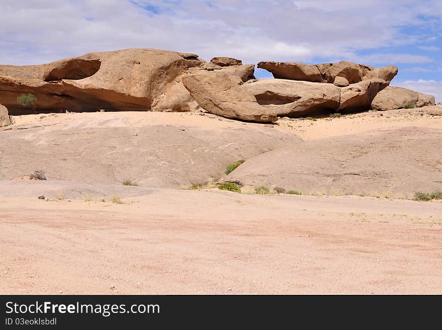 Vogelfederberg rock made of sandstone in Namib-Naukluft national park in Namibia. Vogelfederberg rock made of sandstone in Namib-Naukluft national park in Namibia.