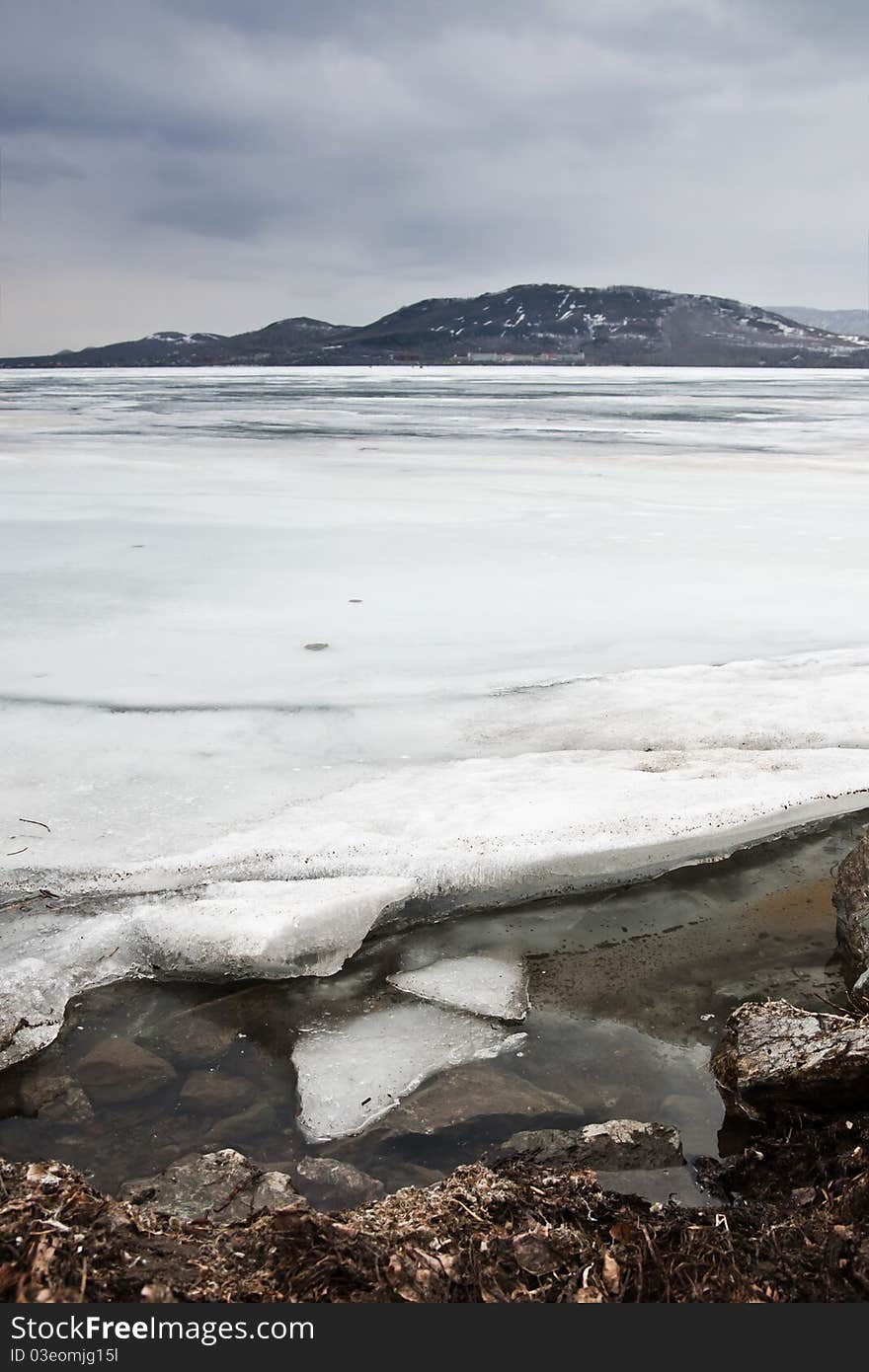 Spring ice on the coast of lake