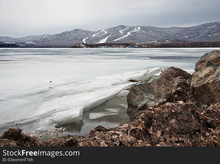 Spring ice on the coast of lake