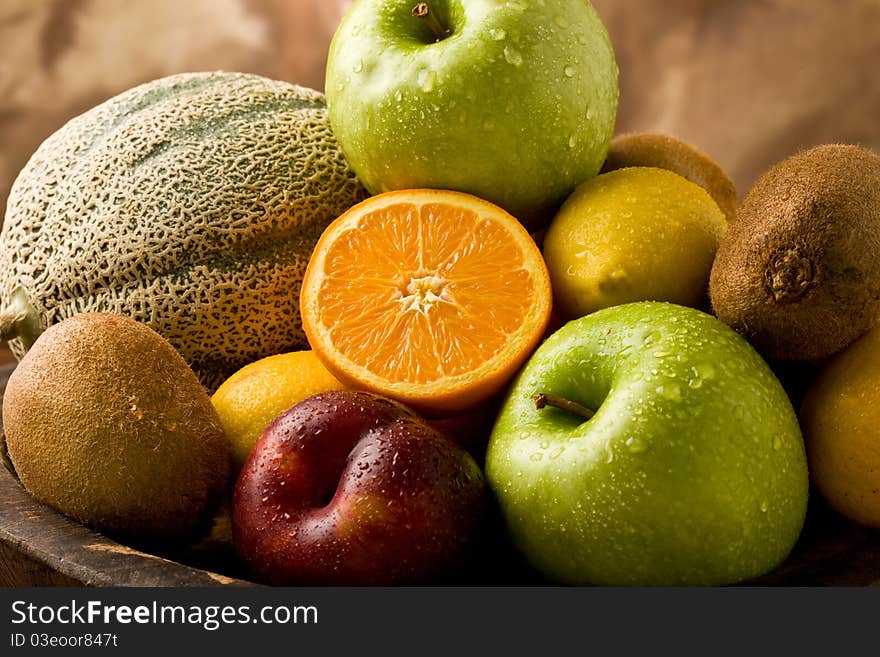 Photo of different organic fruits with water drops. Photo of different organic fruits with water drops