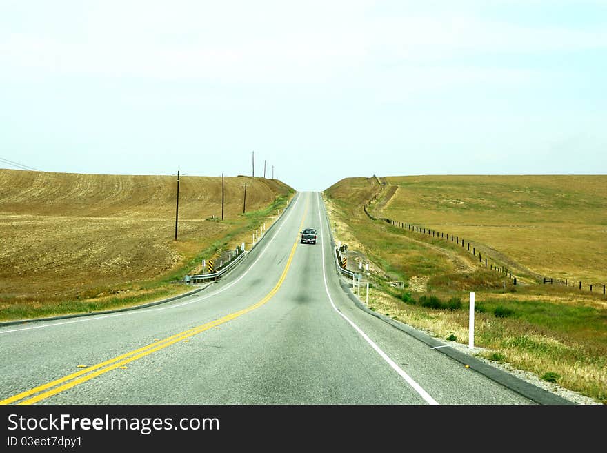 Taken while driving to a rig near santa maria. The car in the front gave a lonely feeling for driving on a highway with no end. Taken while driving to a rig near santa maria. The car in the front gave a lonely feeling for driving on a highway with no end