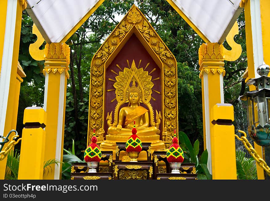 Beautiful golden buddha statue with a set of altar table