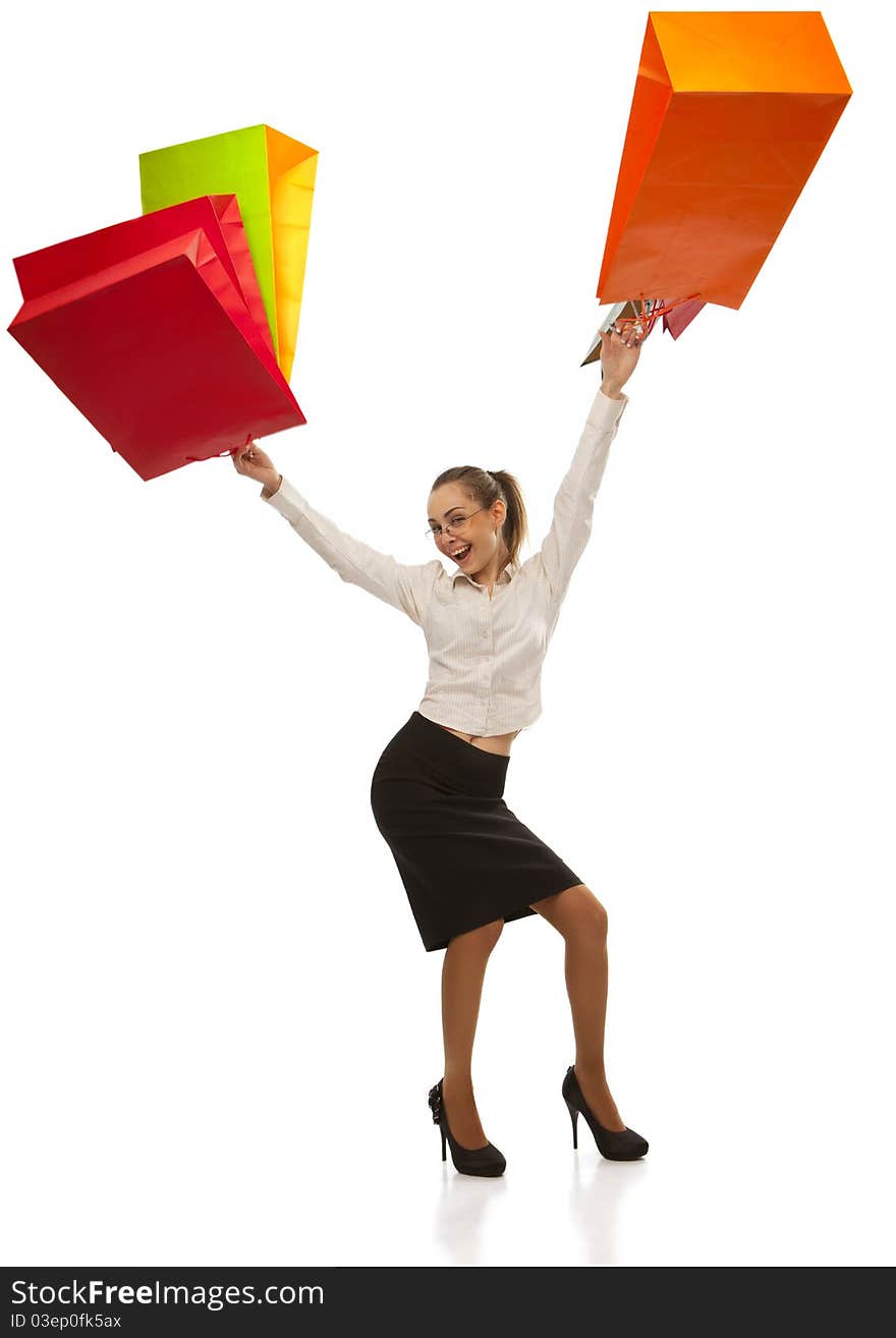 Lovely stylish woman swinging her arms  with shopping bags over white. Lovely stylish woman swinging her arms  with shopping bags over white