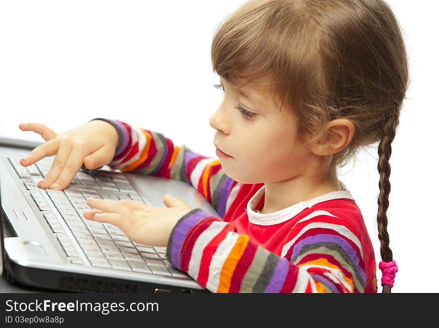 Portrait of a little girl with a laptop