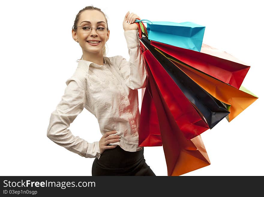 Businesswoman with shopping bags over white. Businesswoman with shopping bags over white