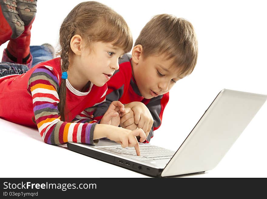 Kids laying with notebook