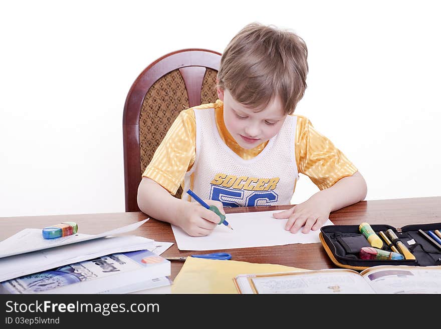 A boy draws with a pencil. A boy draws with a pencil