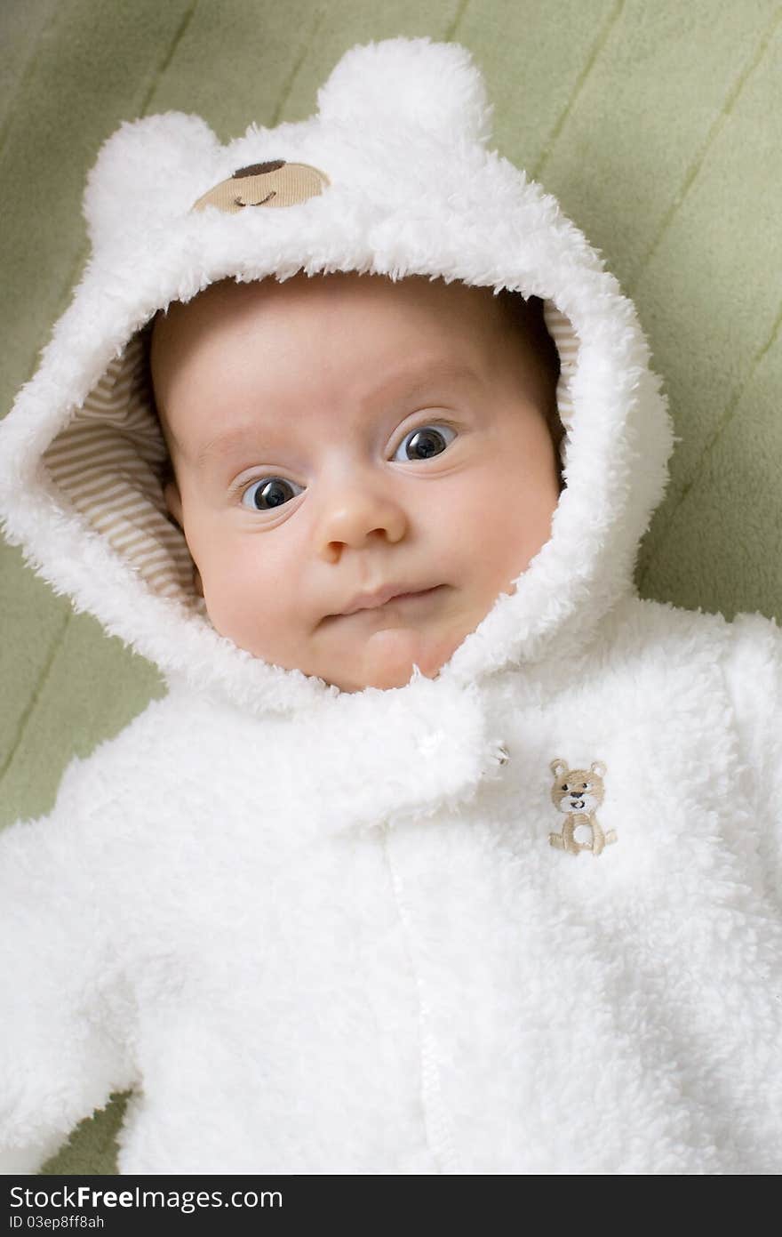 Baby boy in a white bear suit. Baby boy in a white bear suit