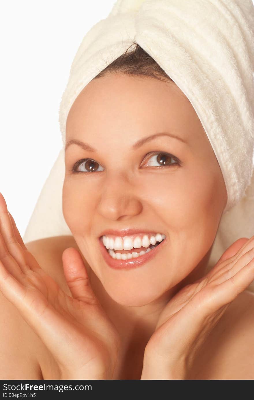 Beautiful happy woman standing on a white background