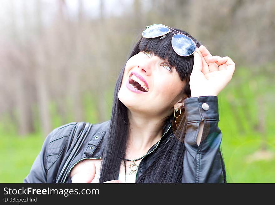 Beautiful young woman wearing sunglasses