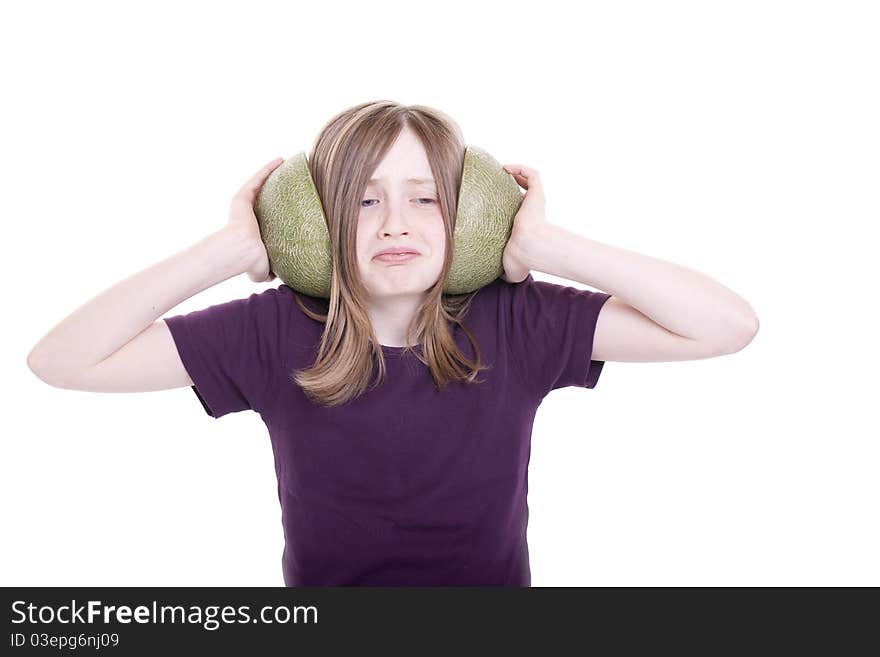 Small girl holds the melons before the ears. Small girl holds the melons before the ears