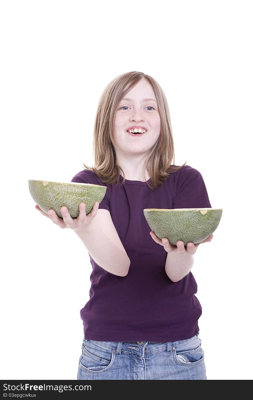 A girl holds melon halves in the hand. A girl holds melon halves in the hand