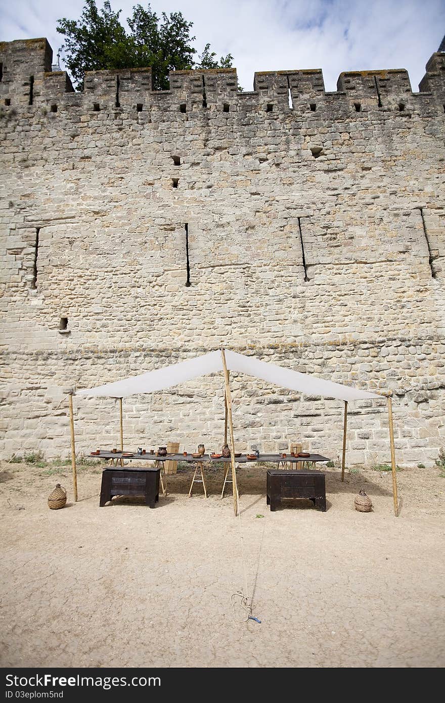 City wall of Carcassonne with market stall. City wall of Carcassonne with market stall