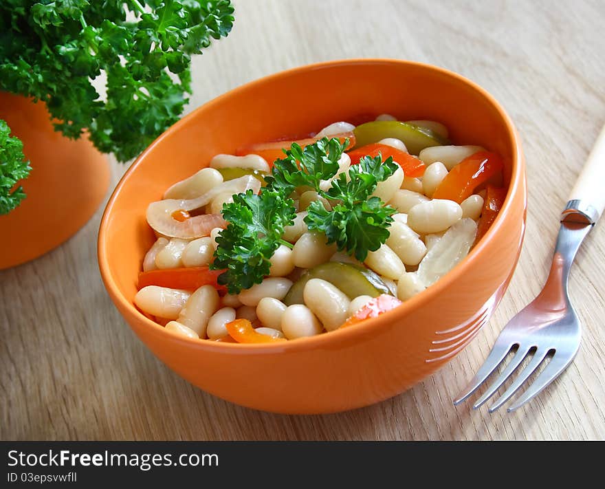 A Bowl Of Stewed Beans And Vegetables.