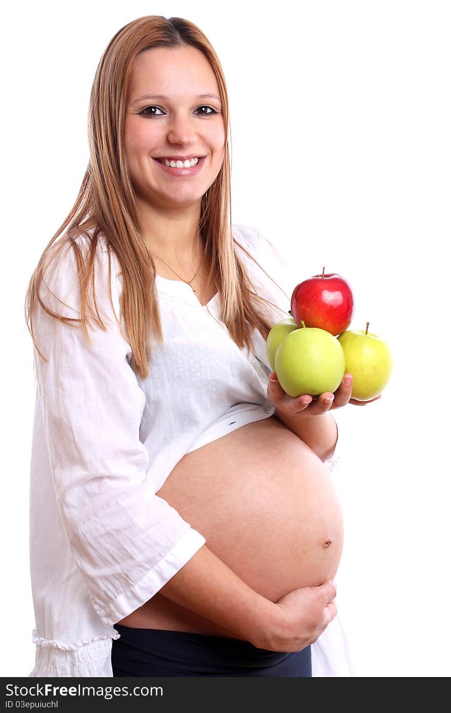 Smiling pregnant woman with apples