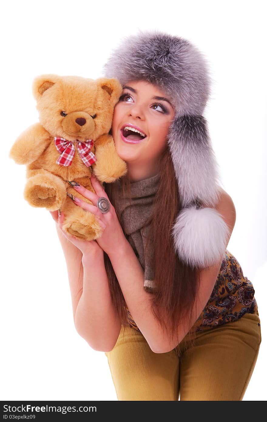 Beautiful longhair girl is holding the teddy bear. Beautiful longhair girl is holding the teddy bear