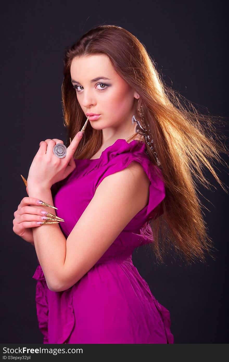 Beautiful young longhair brunette in a romantic pose. Beautiful young longhair brunette in a romantic pose