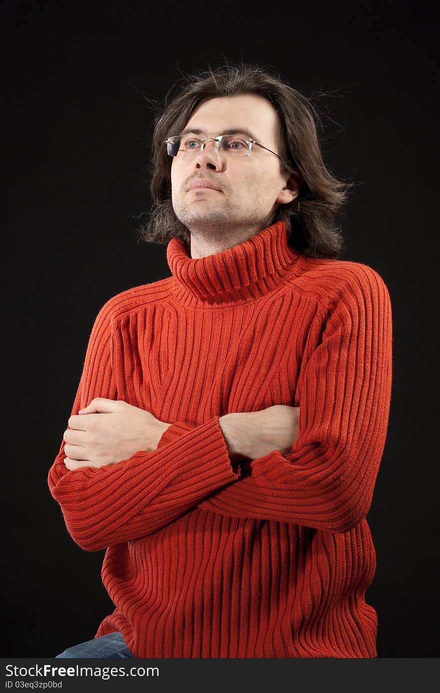 Man in red sweater and glasses.