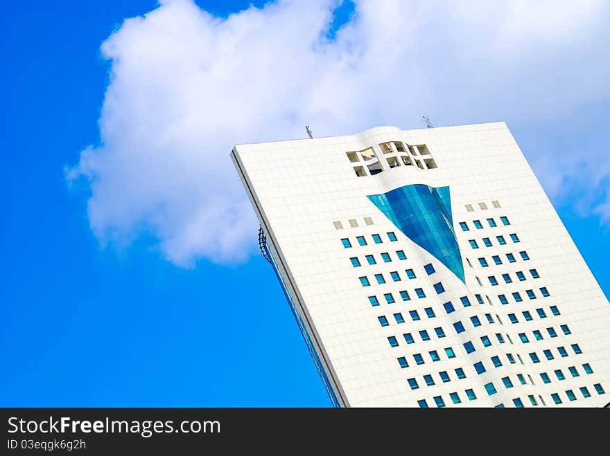 Blue sky and clouds behind the skyscraper. Blue sky and clouds behind the skyscraper