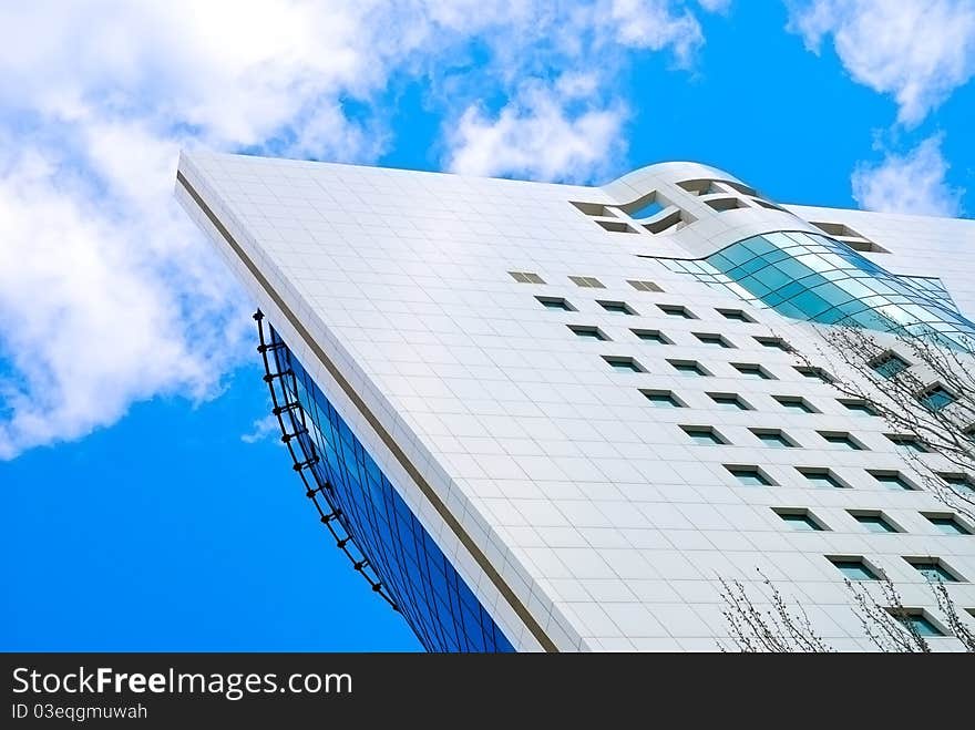 Blue sky and clouds behind the skyscraper. Blue sky and clouds behind the skyscraper