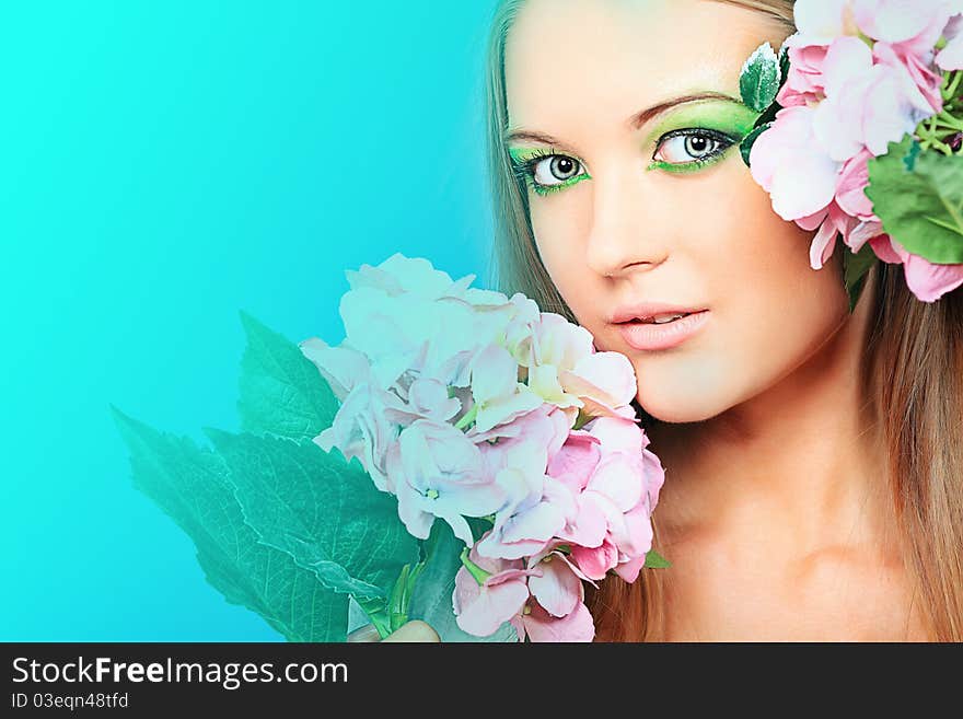 Portrait of a beautiful young woman with spring make-up. Beauty, fashion. Portrait of a beautiful young woman with spring make-up. Beauty, fashion.