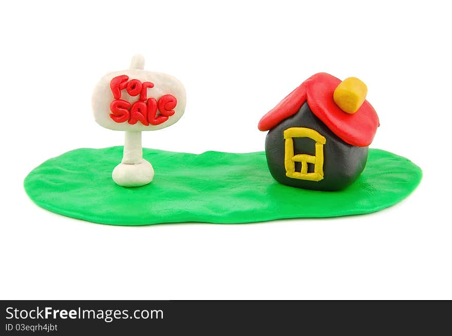 Plasticine house and For Sale real estate sign isolated on white backgroud