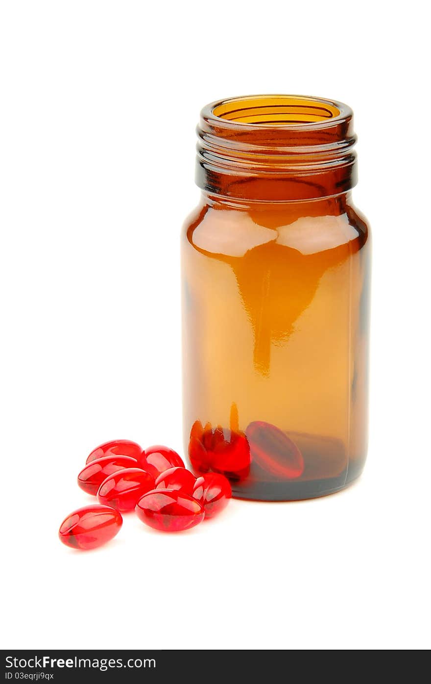 Red vitamin pills in vial isolated on white background. Red vitamin pills in vial isolated on white background