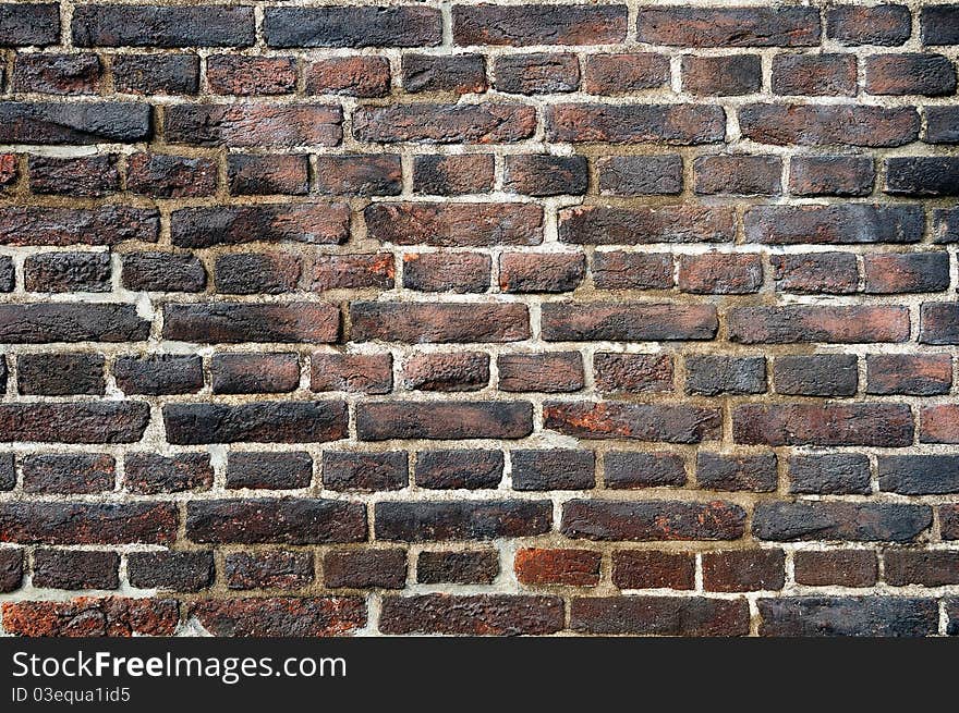 Old Wall Made Of Flamed Bricks