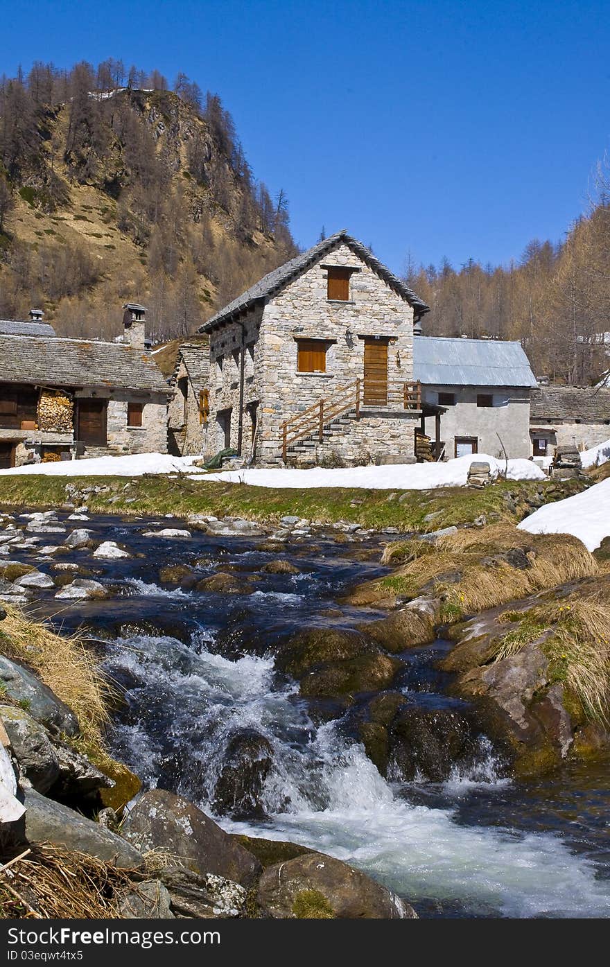 A little village in a mountain landscape. A little village in a mountain landscape