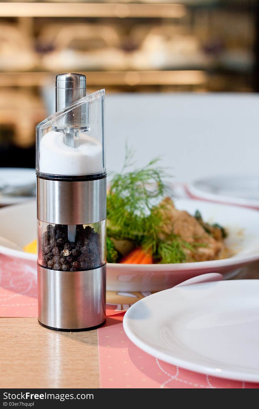 Salt and pepper in metal shaker