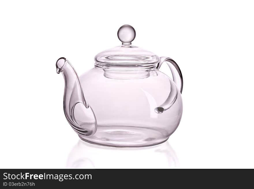 Glass teapot against white background