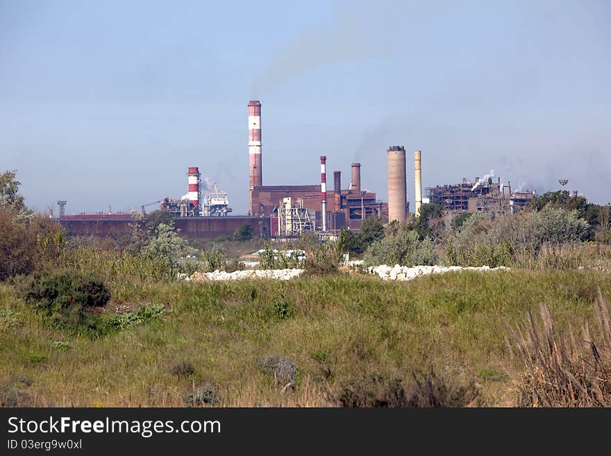 Industrial plant rejecting fumes in atmosphere. Industrial plant rejecting fumes in atmosphere