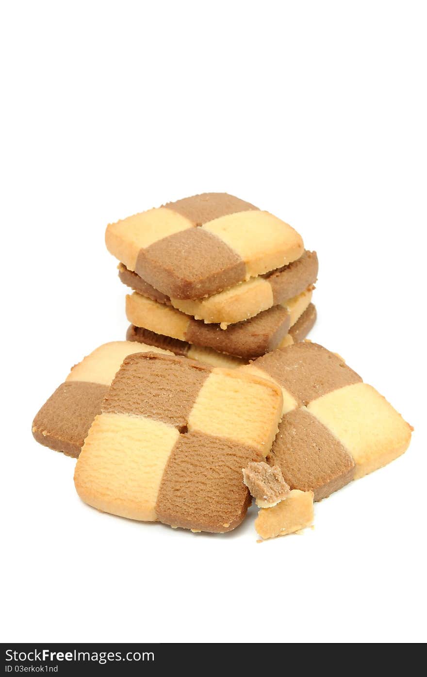 Vanilla and cocoa biscuits with crumbs isolated on a white background