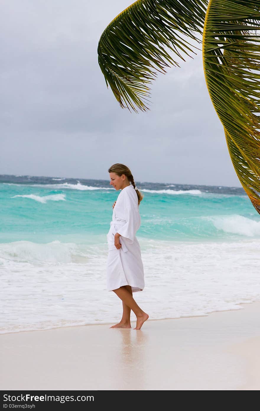 Young woman on a tropical beach